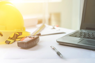 Concept architects, equipment architects On the desk with a blueprint in the office, Vintage, Sunset light.Selective Focus