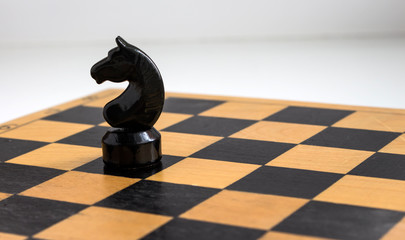 black chess knight on the Board