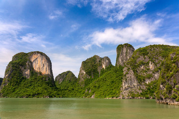Fototapeta na wymiar Halong Bay rock formations on a sunny day, UNESCO world natural Heritage, Vietnam.