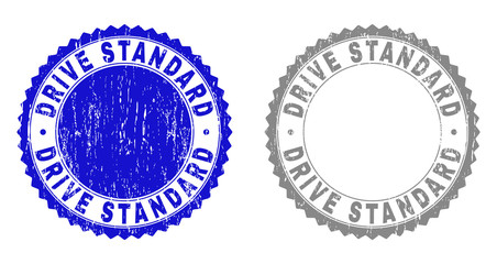 Grunge DRIVE STANDARD stamp seals isolated on a white background. Rosette seals with grunge texture in blue and gray colors. Vector rubber watermark of DRIVE STANDARD title inside round rosette.