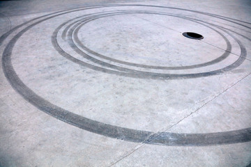Fototapeta na wymiar wheel track is on the cement ground