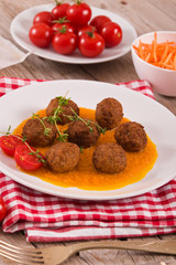 Meatballs with mashed carrots. 