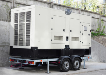 Standby power natural gas backup generator with control panel.  Standby power generator outdoor.