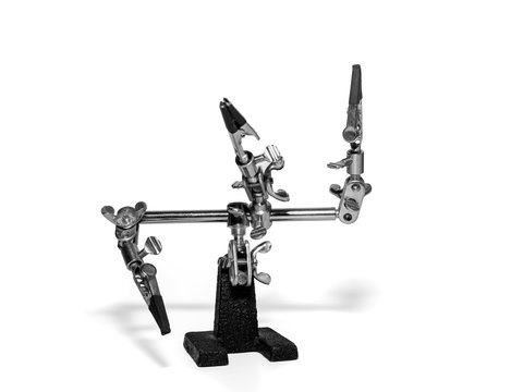 helping hand, third hand or auxiliary clip tool, platinum holder in front of a white background