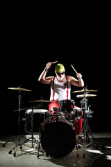 Obraz na płótnie Canvas Drummer playing on drum set