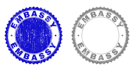 Obraz premium Grunge EMBASSY stamp seals isolated on a white background. Rosette seals with grunge texture in blue and gray colors. Vector rubber stamp imitation of EMBASSY caption inside round rosette.