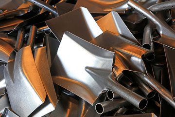 Piles of steel spades