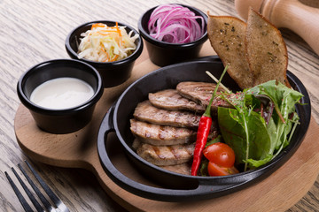 Fired beef tongue served with chili pepper