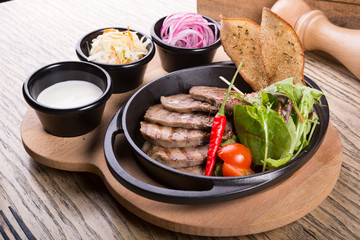 Fired beef tongue served with chili pepper