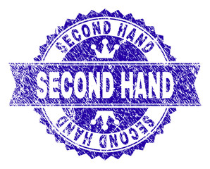 SECOND HAND rosette stamp seal watermark with distress effect. Designed with round rosette, ribbon and small crowns. Blue vector rubber watermark of SECOND HAND title with dirty style.