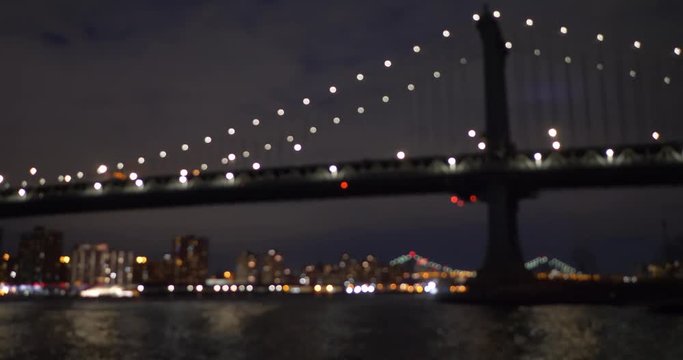 View of Manhattan bridge at night New York City United States of America. Defocused lens