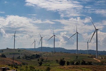 Obraz premium Wind turbines farm utility for eco energy on the mountain.