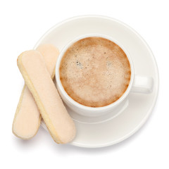 White ceramic cup of coffee with a savoiardi ladyfinger cookie on a plate