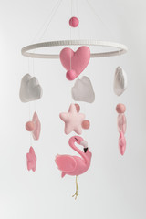 Colorful and eco-friendly children's mobile from felt for children. On white background