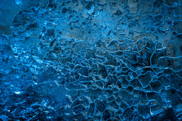 Blue light. Ice texture background. Close-up.Soft focus.