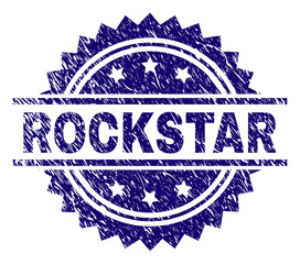 ROCKSTAR stamp seal watermark with distress style. Blue vector rubber print of ROCKSTAR caption with scratched texture.