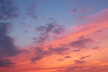 Naklejka na ściany i meble Beautiful fiery pink sunset in blue sky, natural background 