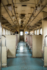 View in the old train cabin. The train interior is old and dirty.