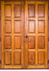 Fototapeta premium Double wooden doors closed for the surface and the background.