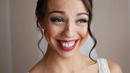 Portrait of the beautiful gorgeous bride with lovely smile is laughing and having fun