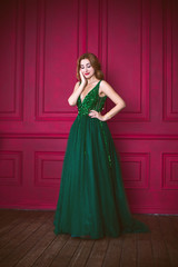 Woman in gorgeous green long evening chiffon dress, fashionable trend for ladies 