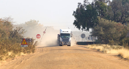 Truck on a dirt gravel road © michaklootwijk