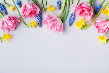 Border from beautiful spring flowers. Greeting card for International Women Day. Flat lay.