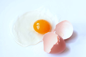 Broken egg isolated on white background.