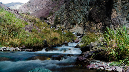 Small waterfall to Too-Ashuu pass and Kara Balta river and valle