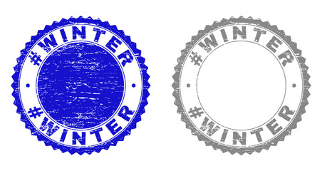 Grunge #WINTER stamp seals isolated on a white background. Rosette seals with grunge texture in blue and grey colors. Vector rubber stamp imprint of #WINTER text inside round rosette.
