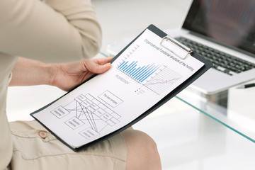 close up. businesswoman analyzing the annual report .