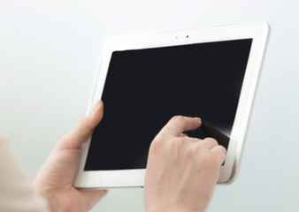 close up. businesswoman pushing using digital tablet.