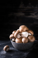 Harvest of mushrooms in plate. Selective focus. Royal champignon. Vegan. Vegetarian food, Vitamin. Healthy food. Process of cooking.