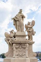 Fototapeta na wymiar Statues on the Charles Bridge in Prague. Architecture of Prague old town