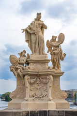 Fototapeta na wymiar Statues on the Charles Bridge in Prague. Architecture of Prague old town