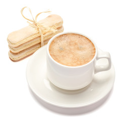 White ceramic cup of coffee with a savoiardi ladyfinger cookie on a plate
