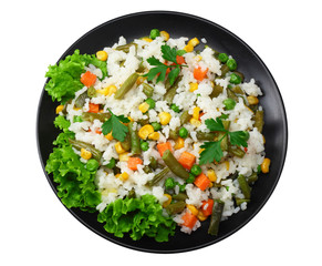 black plate with white rice, green peas, canned corn kernels, cut green beans isolated on white background. top view