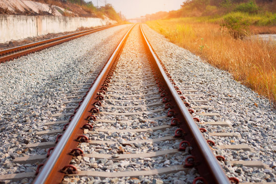 Railroad tracks with sunset - Transportation Concept 