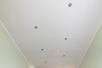 Flattened ceiling in the room, with spotlights installed