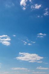 Blue sky with white clouds as a background