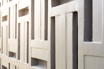 Modern style wall with yellow sunlight for background.