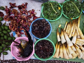 Vegetables and animals selling at morning market in Luang Prabang, Laos