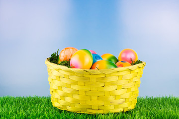 Easter basket with colorful Easter eggs