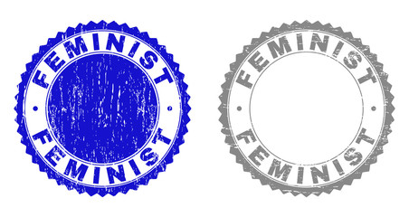 Grunge FEMINIST stamp seals isolated on a white background. Rosette seals with distress texture in blue and grey colors. Vector rubber stamp imitation of FEMINIST title inside round rosette.