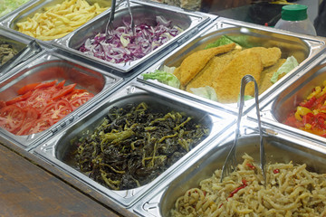 Many trays with foods