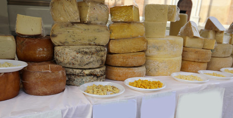 stall with aged cheeses such as pecorino in the alfresco market