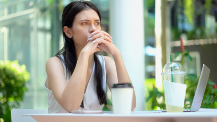 The pretty woman was feeling bored and depressed with waiting