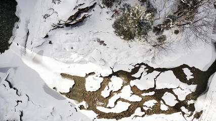 snow covered river delta aerial in 4k