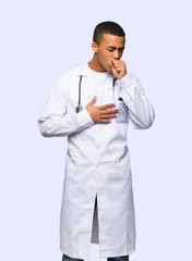 Young afro american man doctor is suffering with cough and feeling bad on isolated background