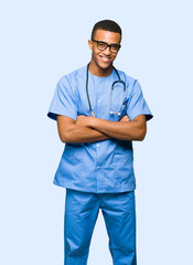 Surgeon doctor man with glasses and smiling on isolated background